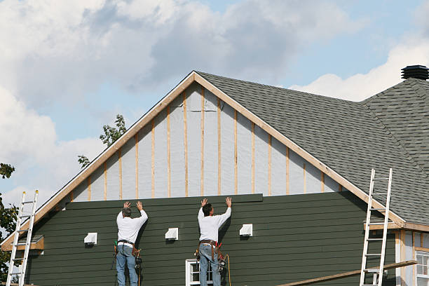 Professional Storm Damage Siding Repair technician working in Huntersville, NC